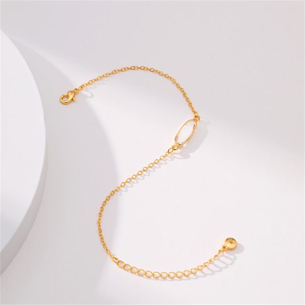 Crystal & 18K Gold-Plated Oval-Cut Charm Bracelet For Sale